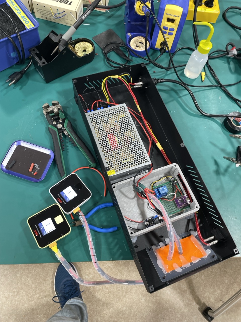 Remotely controlled battery charger power supply